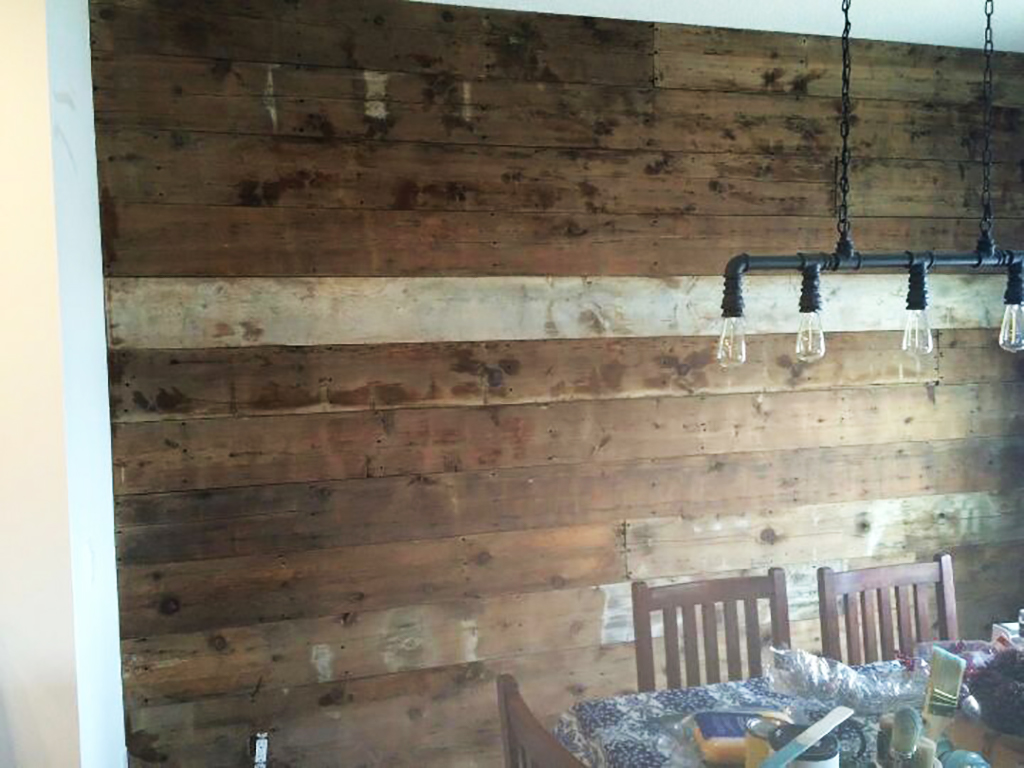 Reclaimed barnwood accent wall in a dining room
