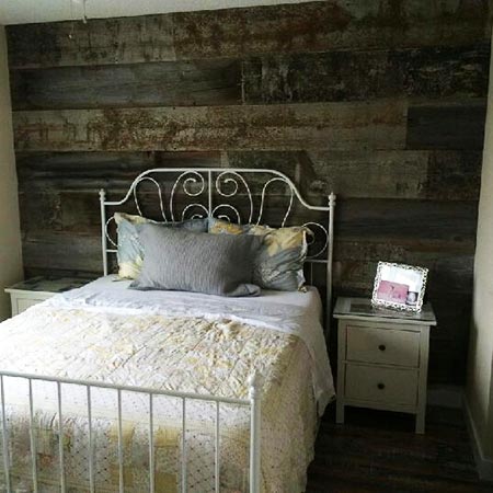 reclaimed wood accent wall in bedroom